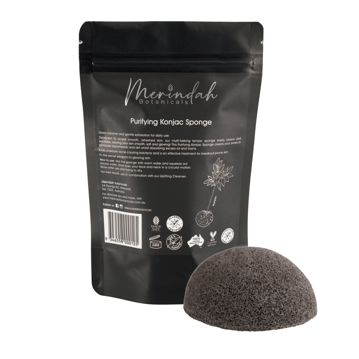 A black package with the text "Merindah Botanicals Purifying Konjac Sponge" sits upright, ideal for all skin types. In front is a dome-shaped, textured sponge designed for gentle exfoliation. The packaging showcases white lettering and a plant illustration.