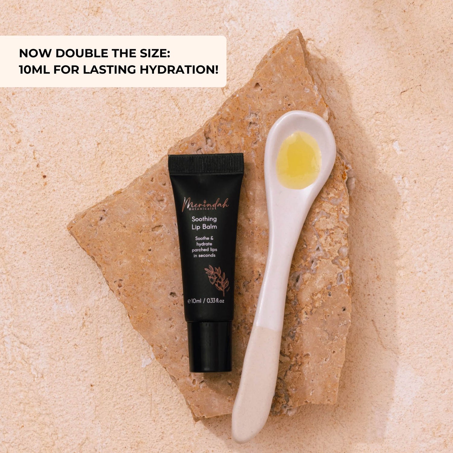 Natural lip balm for dry, chapped lips — Merindah Botanicals Soothing Lip Balm tube with a spoonful of balm, showing hydrating texture.