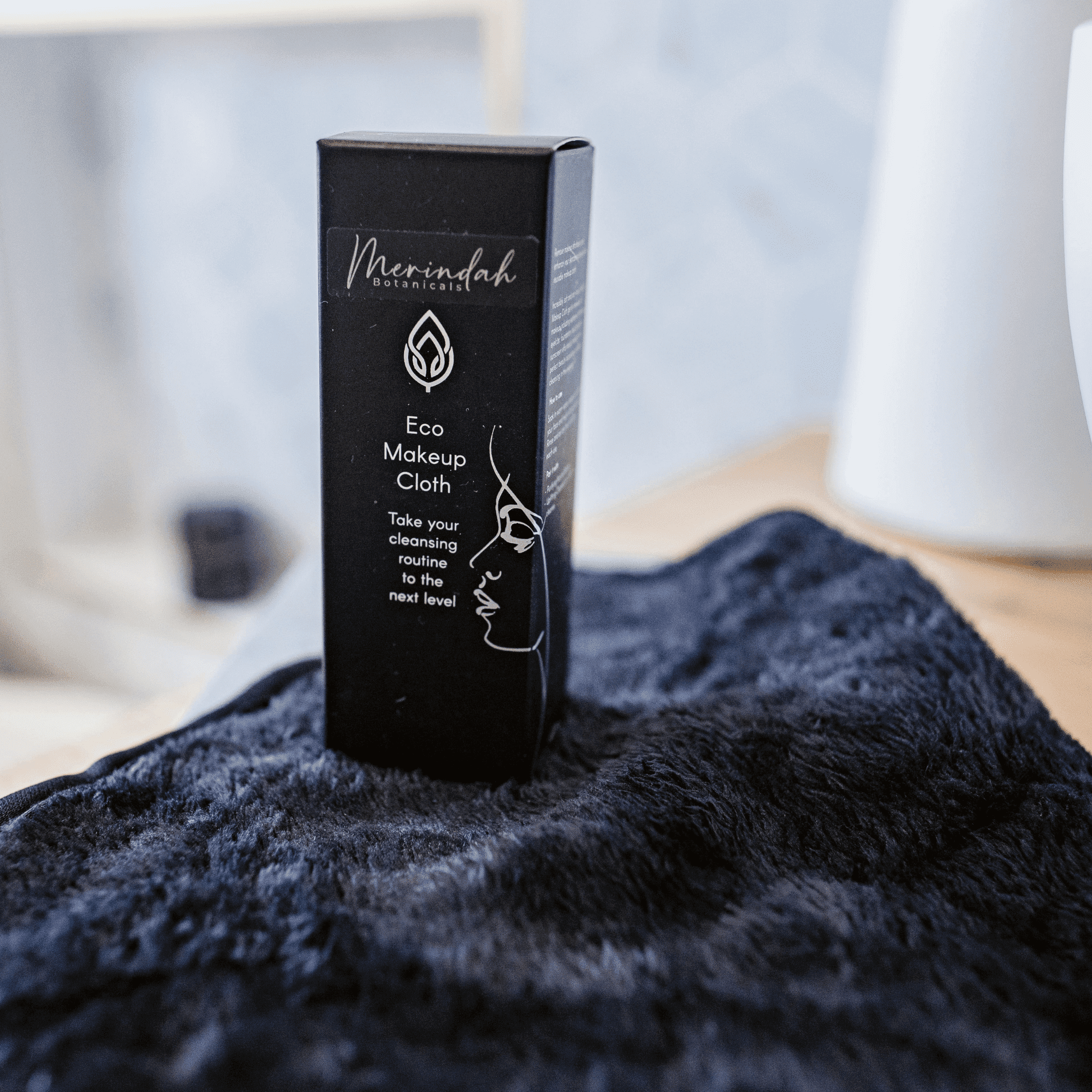 Eco Makeup Cloth with packaging — soft, reusable black microfibre cloth designed to replace disposable wipes.